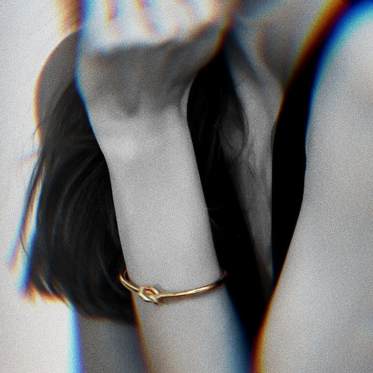 A female model wearing Gold-plated Bangle Bracelet