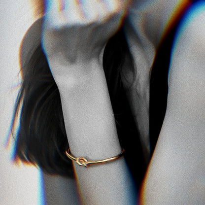 A female model wearing Gold-plated Bangle Bracelet