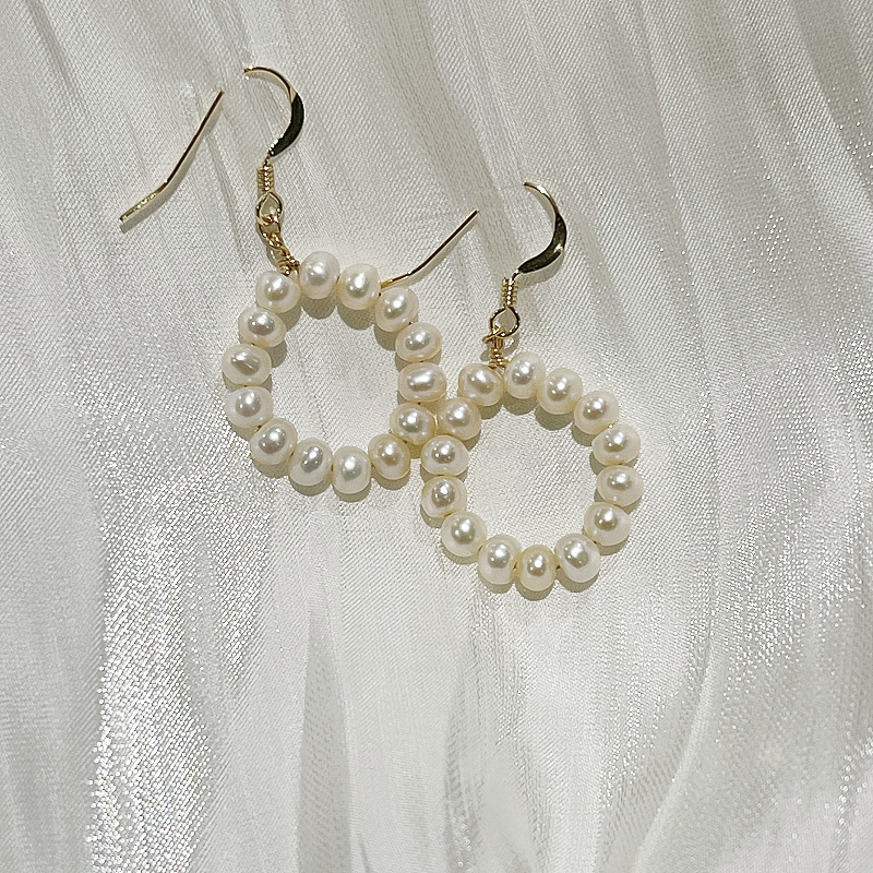 Classic Freshwater Pearl Hoop Earrings 14k Gold Filling Fanny on white satin fabric image