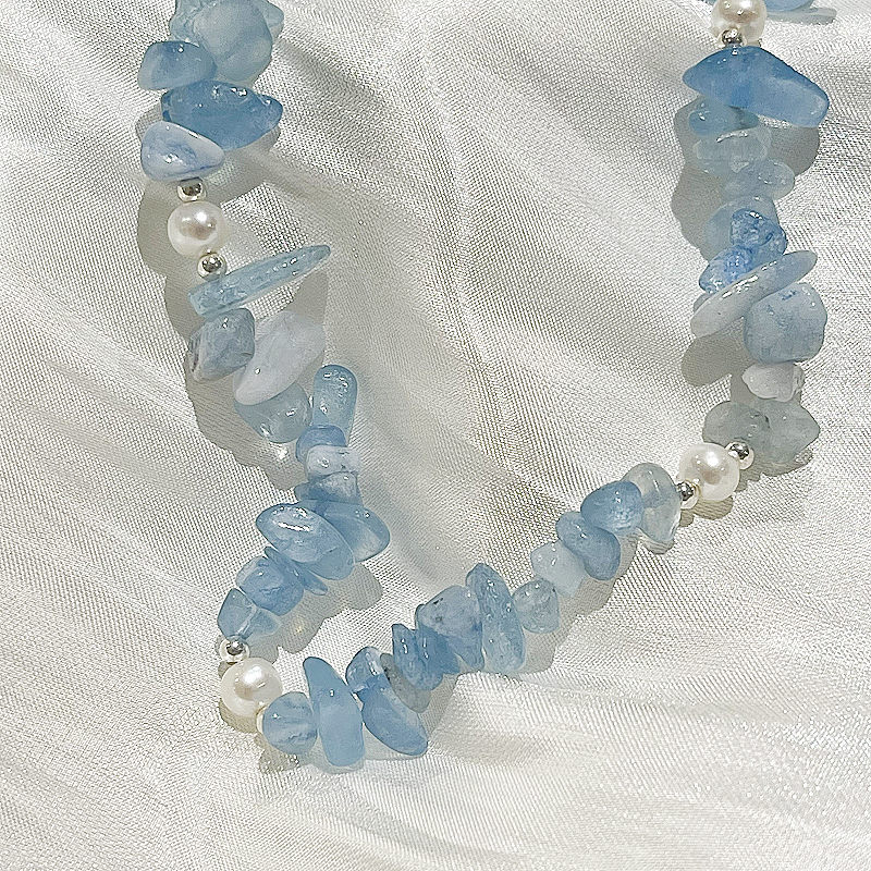 Aquamarine Pearl Necklace Claire studio image with white satin fabric