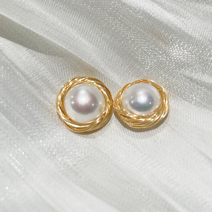 Bird's Nest Pearl Stud Earrings Sarah  product image on white satin fabric