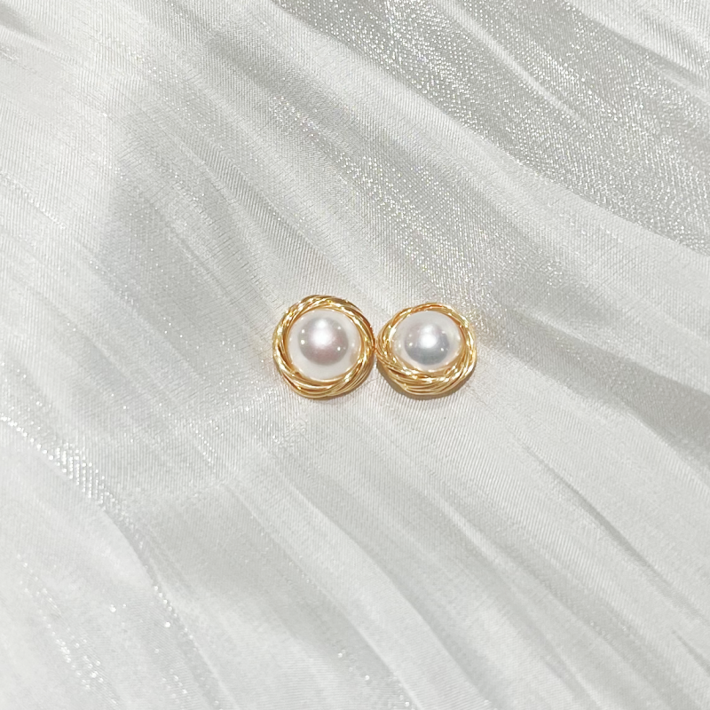 Bird's Nest Pearl Stud Earrings Sarah  product image on white satin fabric with more detail