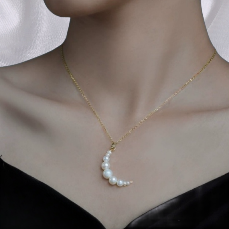 A female model wearing Mermaid Pearl Pendant Necklace Arista