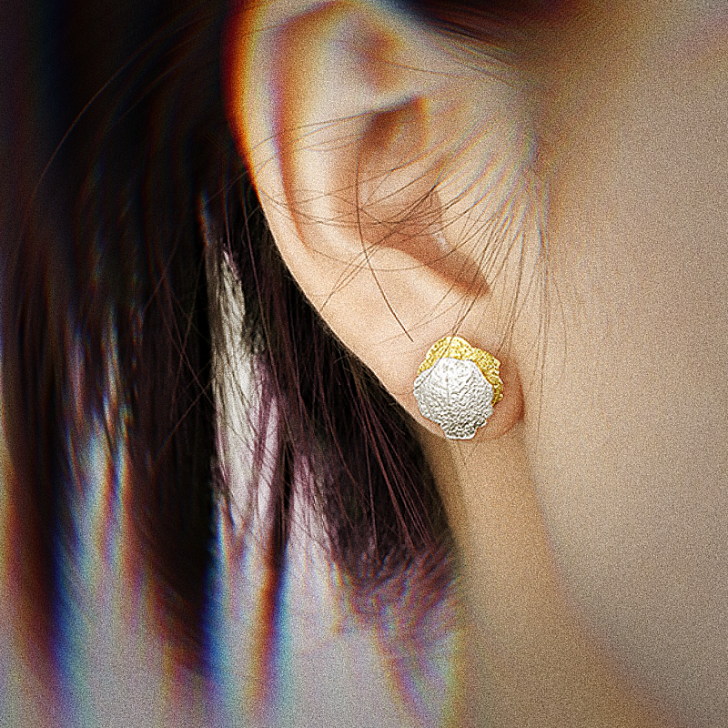 A female model wearing Textured Disc Sterling Silver Stud Earrings Billie