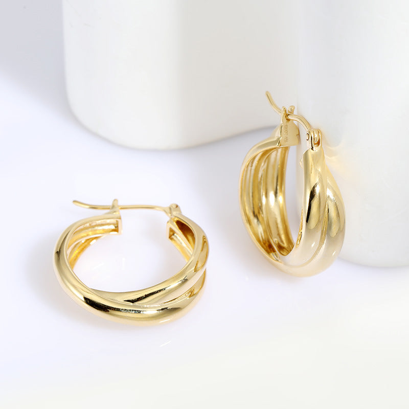 18k Gold-plated Sterling Silver Hoop Earrings Charlotte on a white table studio image