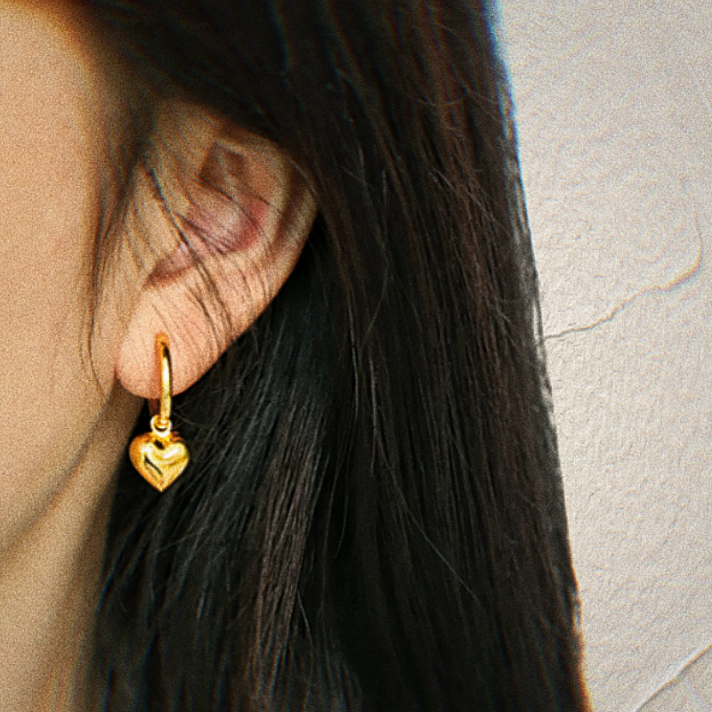 A female model wearing Yellow gold plated Sterling Silver Heart Drop Earrings Leona image